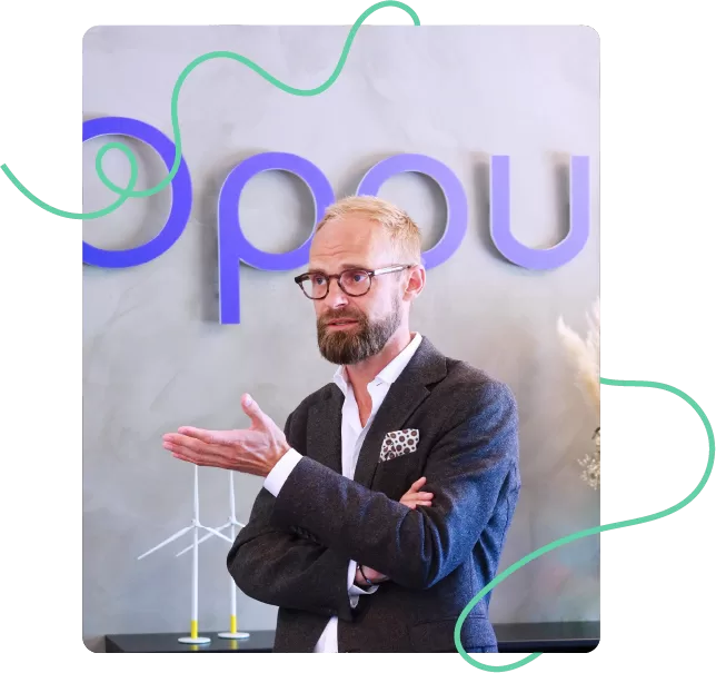 Colleague in the foreground sharing insights during a discussion about impact of learning